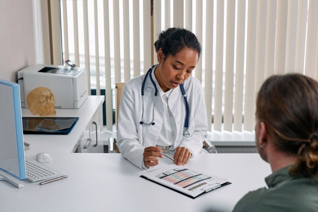 female doctor talking to patient