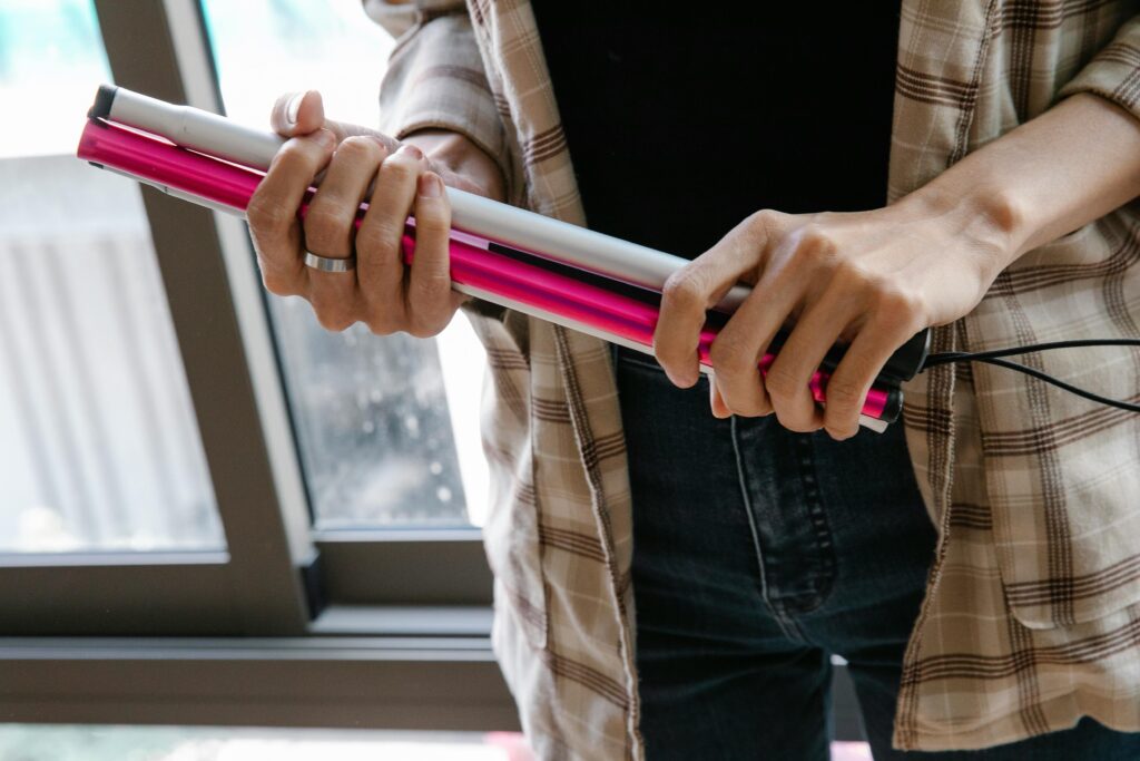 Photo of Person Holding Walking Stick
