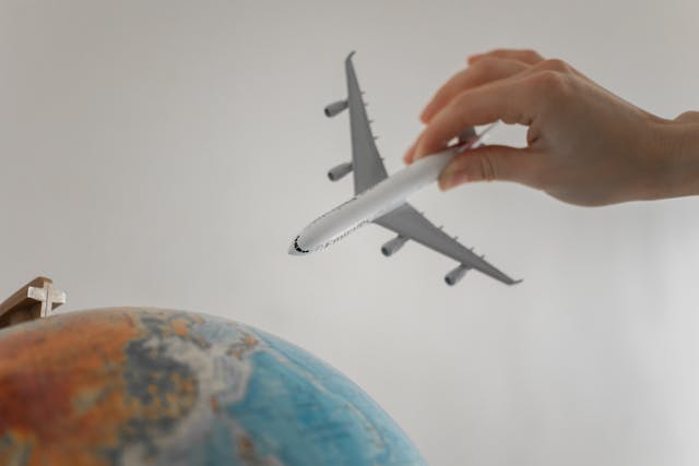 toy plane over a globe