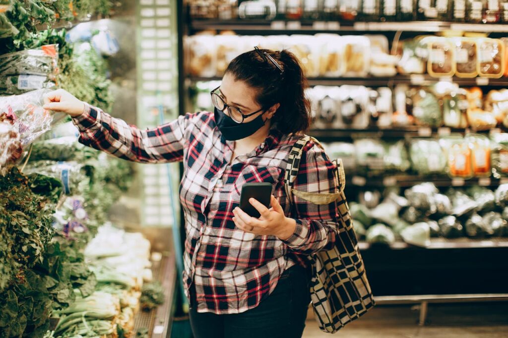 Brunette Woman with Face Mask Shopping in Supermarket
