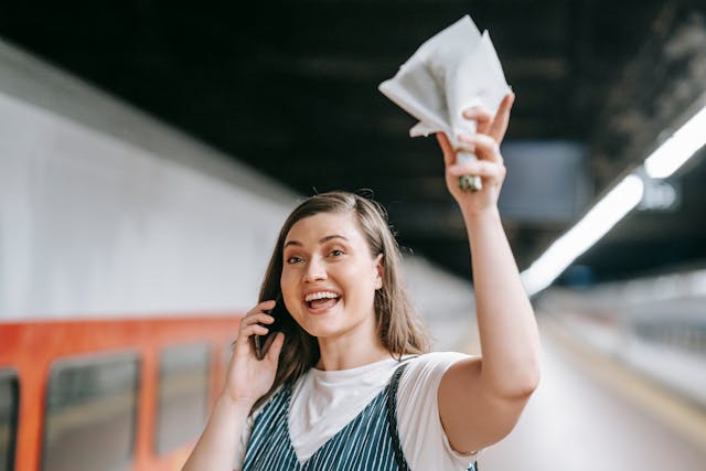 woman on phone in station