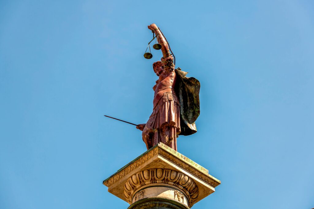 Column of Justice against a Blue Sky
