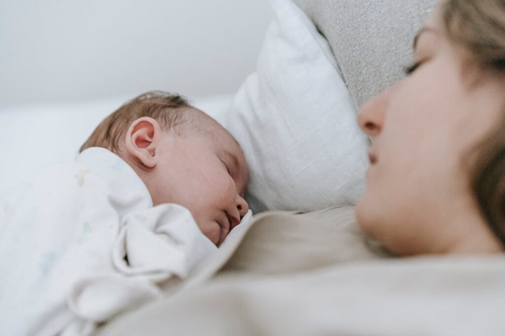 Woman in Bed Switching Alarm Clock Off