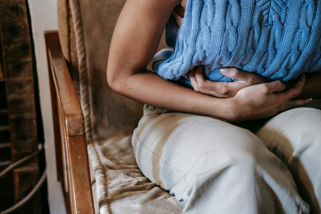 woman with bloating and stomach pain