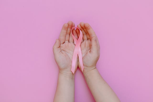 hands holding cancer awareness ribbon