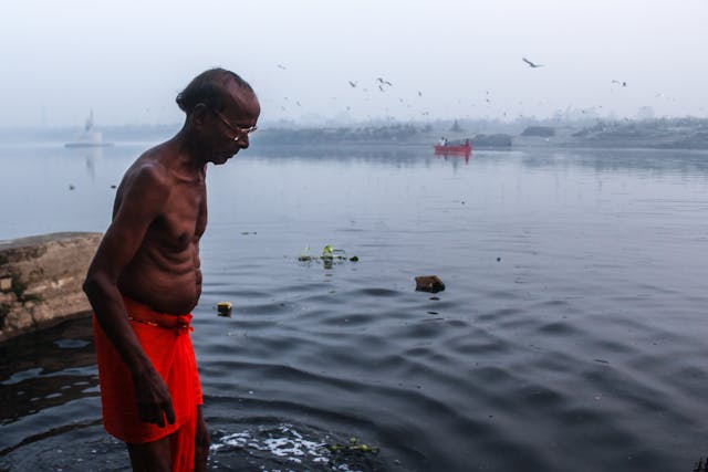 man bathing in river