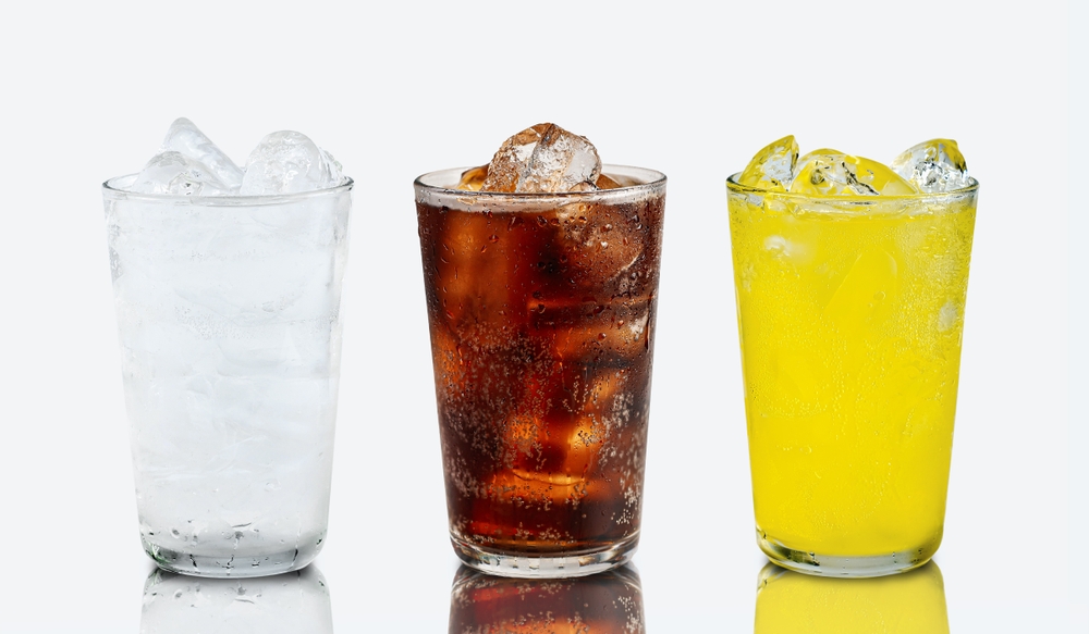Set of cold soft drink  difference flavor in tall glass cola, soda water, orange flavor in tall glass isolated with reflection on white background.