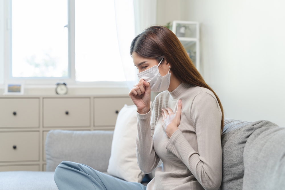 Female unhealthy Sickness, asian young woman, girl unwell and coughing, have cold, sore throat isolated white background suffering with symptom cough feeling bad. Healthcare of Coronavirus, covid-19.