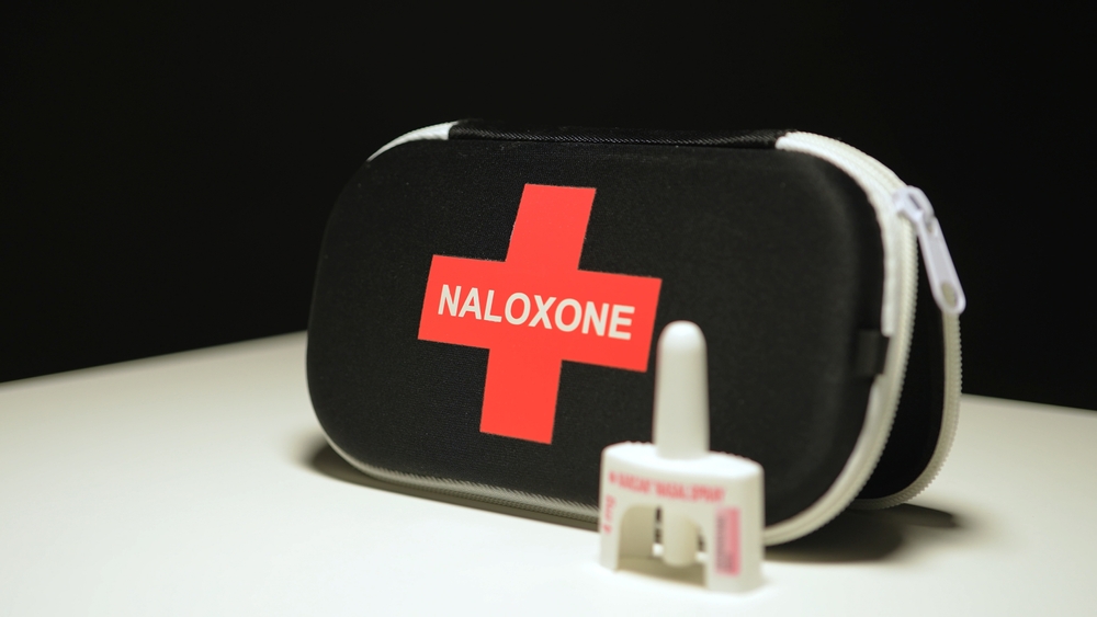 Naloxone and Narcan nasal spray in the emergency overdose kit bag used for recovery from narcotic opioid medications or street drugs overdose: Toronto, Ontario, Canada - March 23, 2024