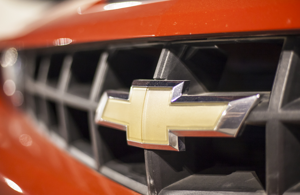 ABU DHABI, UAE - NOV 26, 2016: Chevrolet company logo on a car illuminated at night