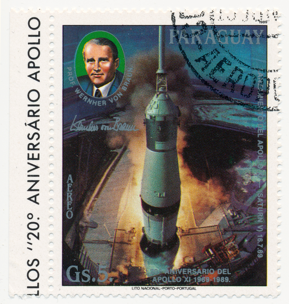 PARAGUAY - CIRCA 1989: A stamp printed in Paraguay, shows start the rocket Saturn-V and portrait of German astronaut a Werner von Braun (1912-1977), series,  circa 1989
