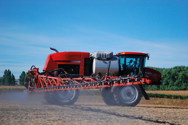 spraying farmalnd with herbicide