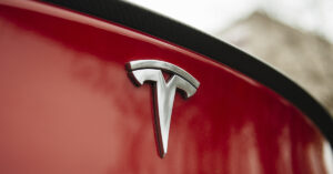 Tesla Driver and Two Children Perish After Rescuers Struggle with Electronic Doors Tesla symbol on back of a car