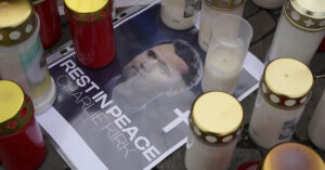 Charlie Kirks picture with candles placed around it. Charlie Kirk Memorial
