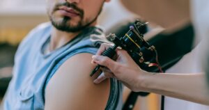 man getting a tattoo