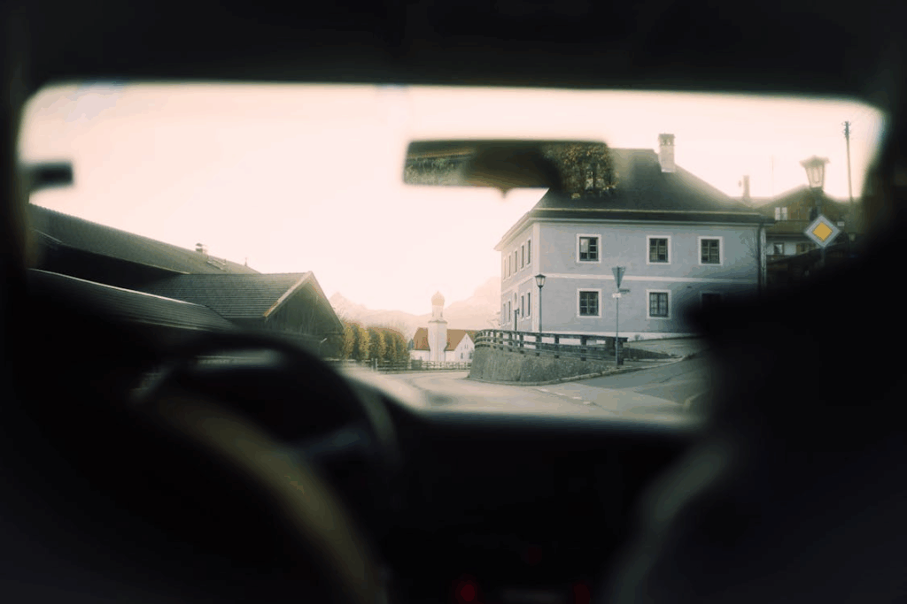 White Painted Building Beside Road towns you should visit