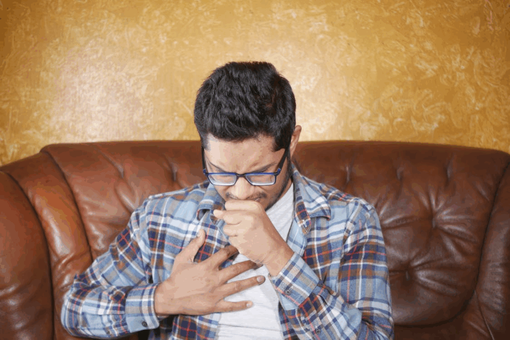 A Man in a Plaid Shirt Coughing clogged arteries warning