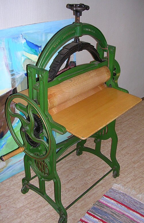 A wooden roller or mangle, used for flattening fabric before modern irons.