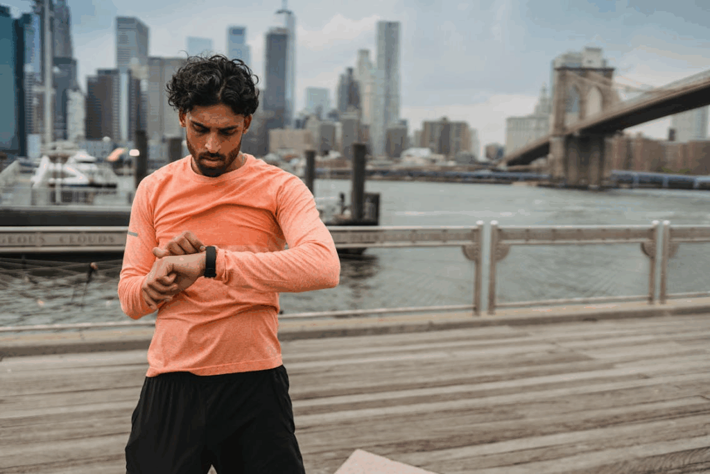 A man in a sports shirt checked his stopwatch