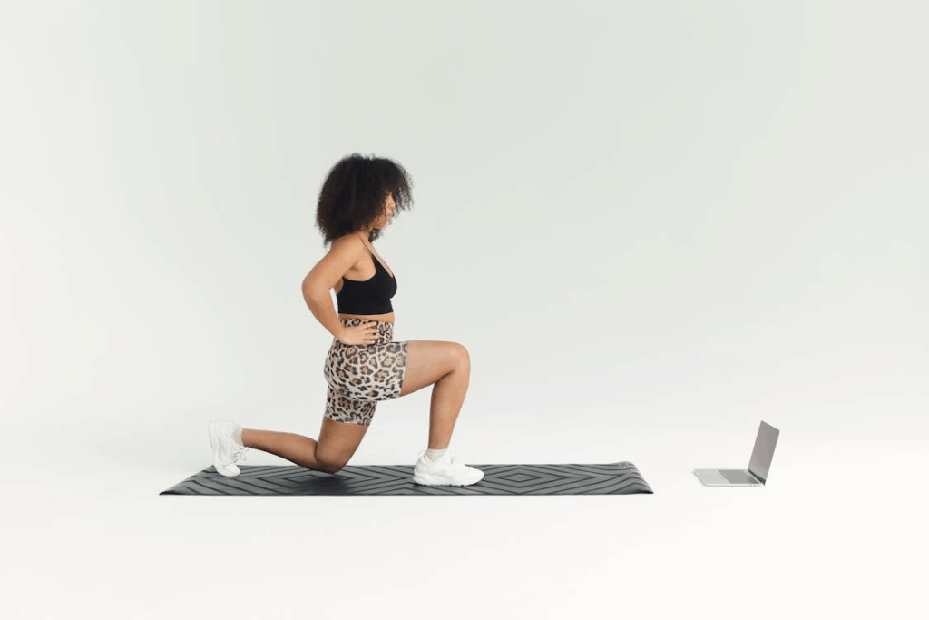 A woman watches an online exercise video