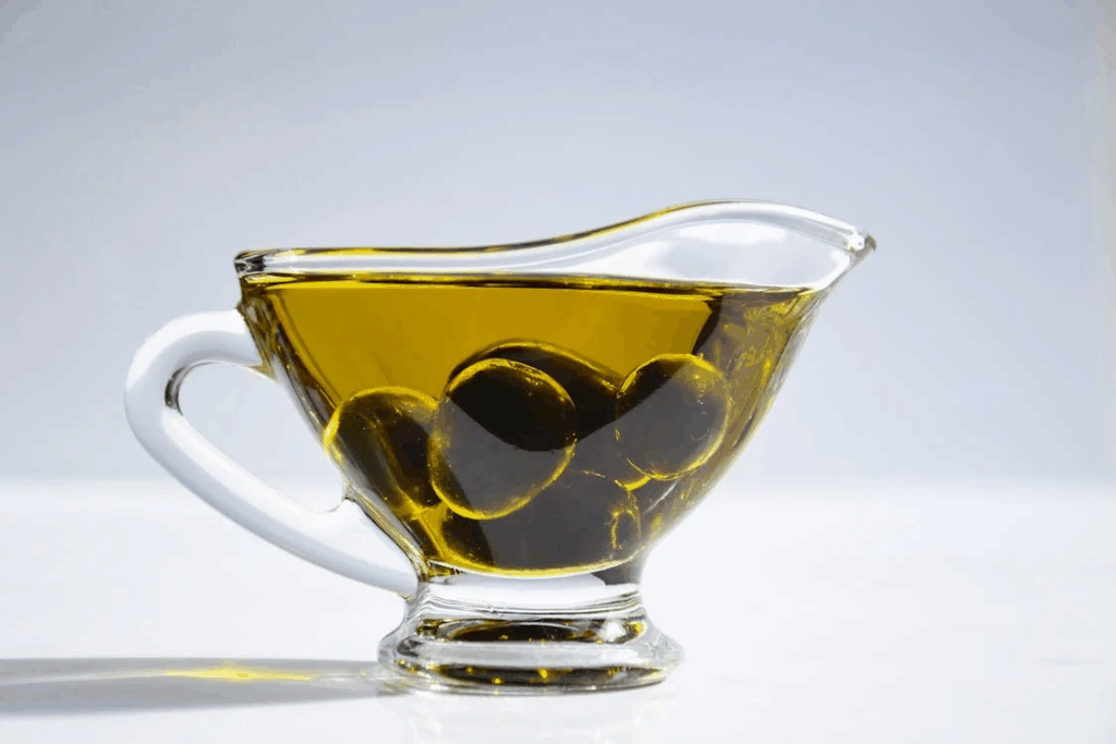 Pictures of olives in a cup of olive oil