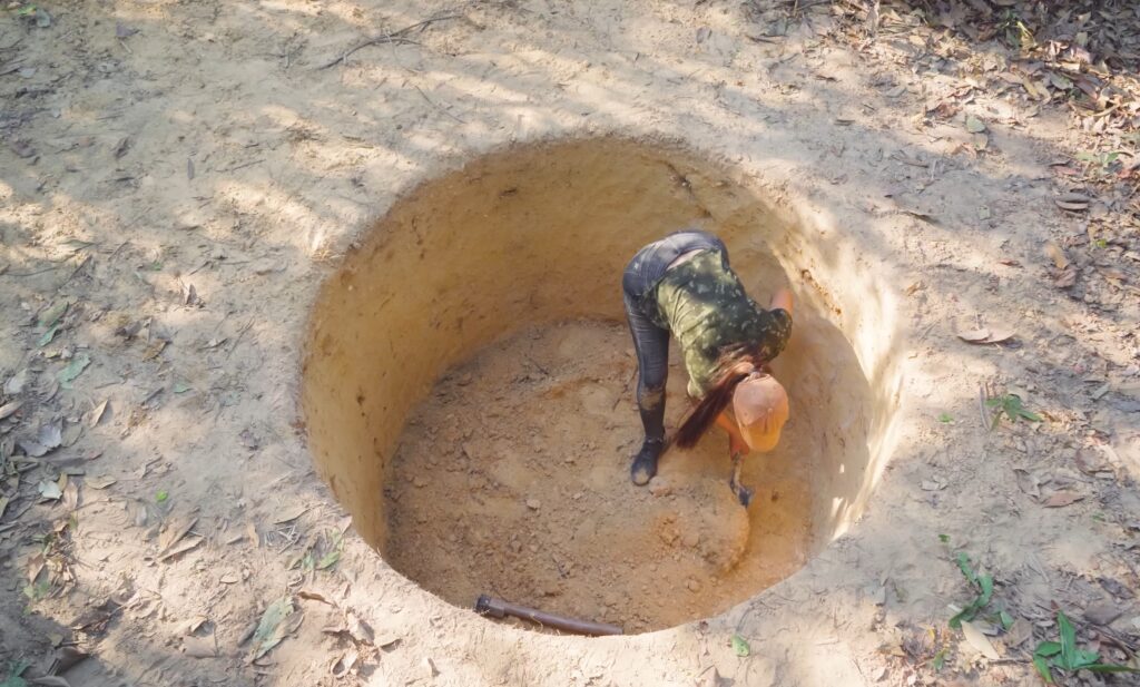 woman digging hole