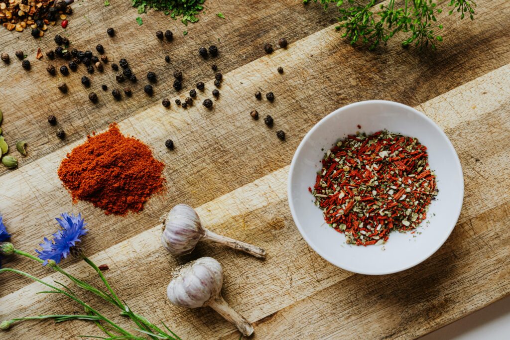 Spices, Herbs and Garlic on Table
