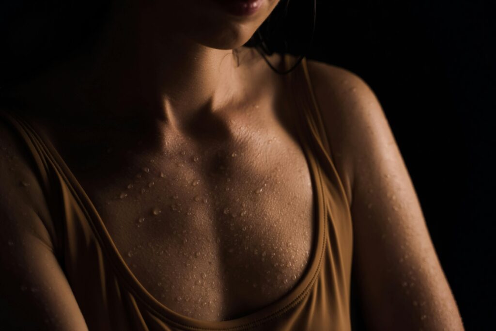 Close Up Photo of Wet Chest of a Woman
