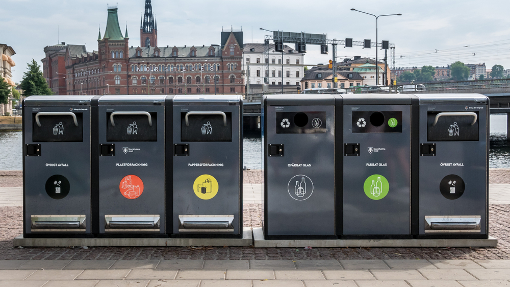 Trash containers for different rubbish in the center of Stockholm, Sweden. Waste collection in Europe for subsequent recycling, eco friendly waste collection