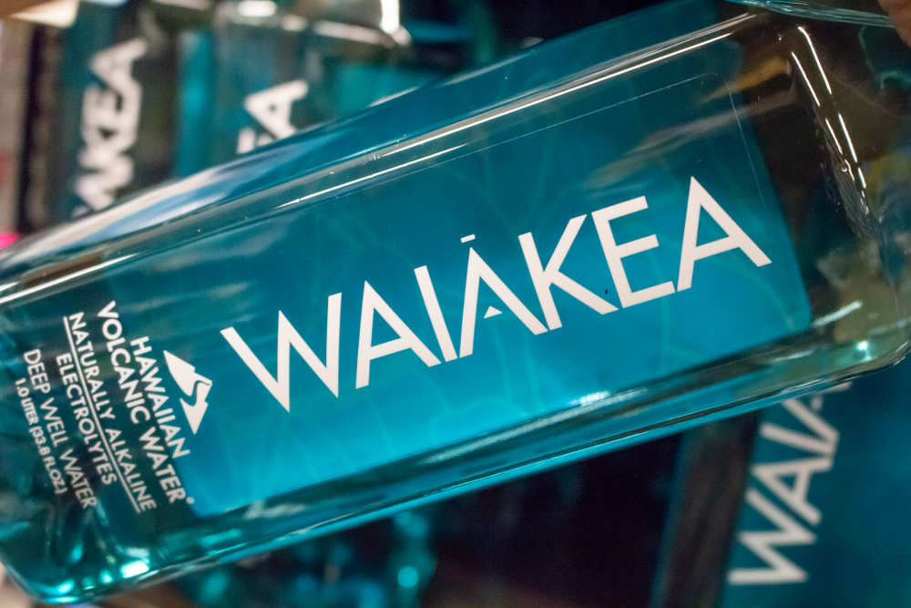 Los Angeles, California, United States: 04-07-2019: A view of a hand holding a bottle of Waiakea water at the grocery store.