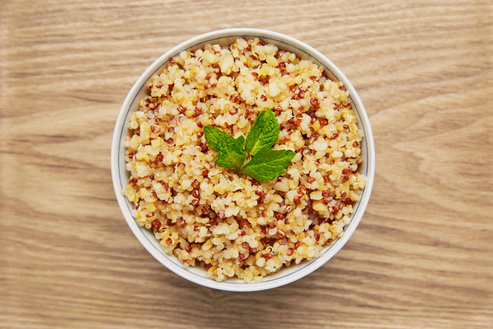 Quinoa Bowl cooked on wood background