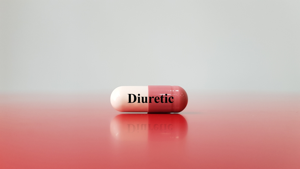 Capsule of diuretic drug. This diuresis medicine used for increase urine excretion. It used for treatment hypertension disease, heart failure, kidney disorder. Medical therapy technology concept.