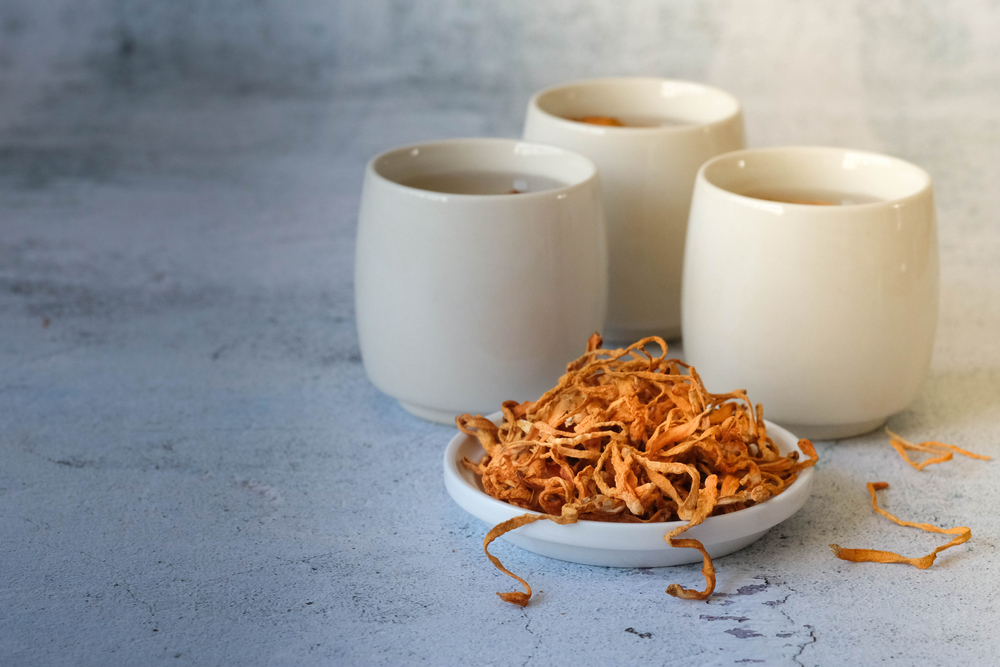 a cup of golden Cordyceps Militaris for tea. good herbal medicine.