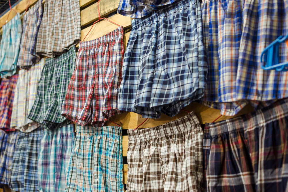 Boxer shorts of various colors and plaid patterns for sale at a tiangge, boutique or flea market. Cheap wholesale Men's underwear.