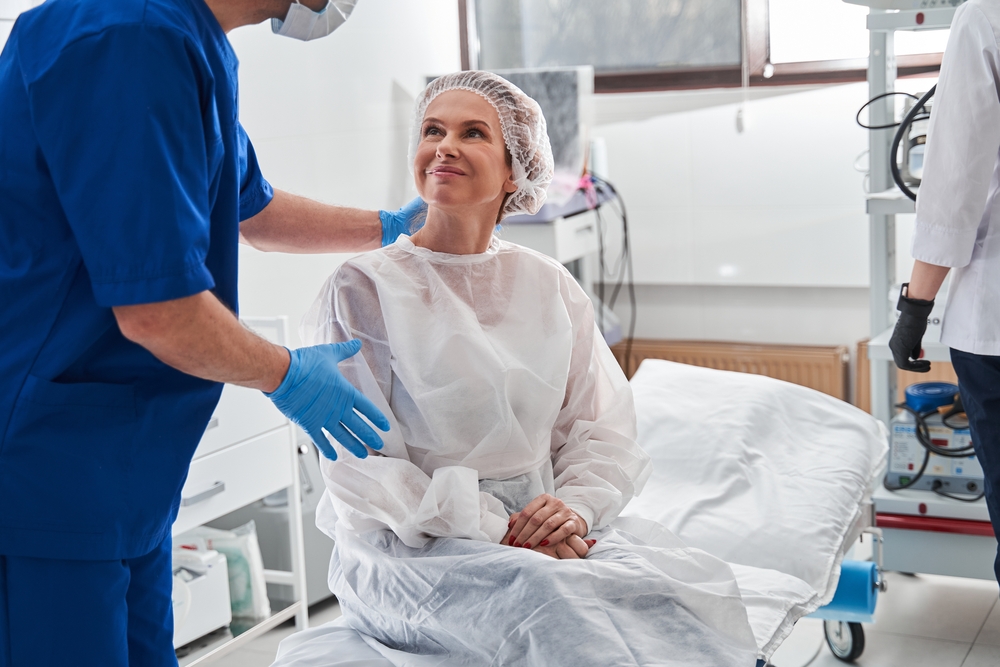 Man calming his patient before the gastroscopy at the modern clinic