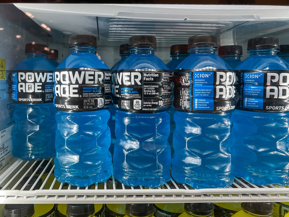 Pearland, TX, USA - March 10, 2022: Powerade Mountain Berry Blast Sports Drink 28 FL OZ bottles on the shelf in a freezer at a grocery store.