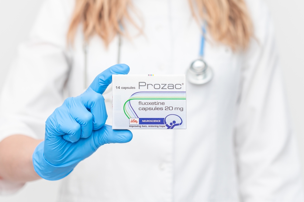 Krasnoyarsk, Russia - September 29th 2022: doctor is holding Prozac in his hands. concept - prescribing antidepressants by a doctor.