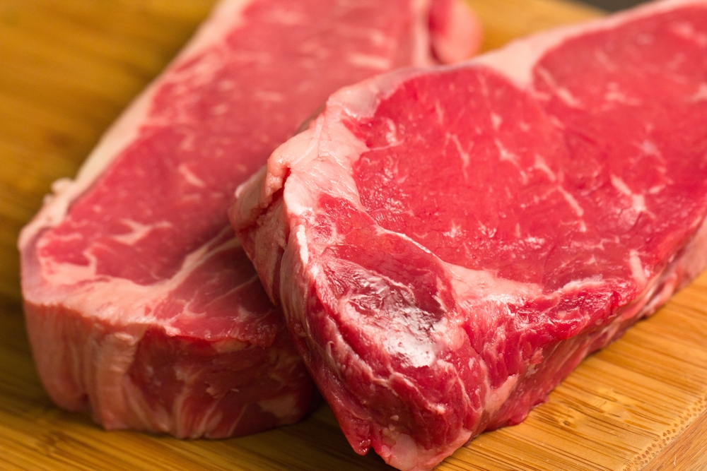 Close-up of Red Raw Steak Cuts of Meat Marbled Ready to Cook Dinner Protein Beef Sections