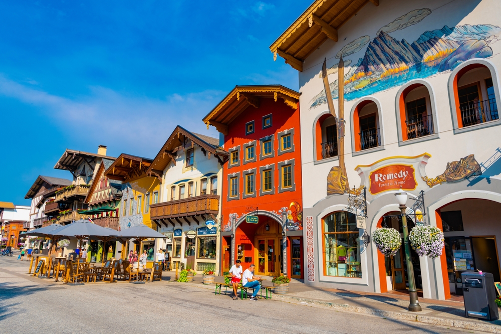 Leavenworth, Washington, USA - July 22, 2024: Bavarian village. Bavarian village of Leavenworth, Washington with sidewalk cafe and shop on street. Bavarian building in old town. Shopping District