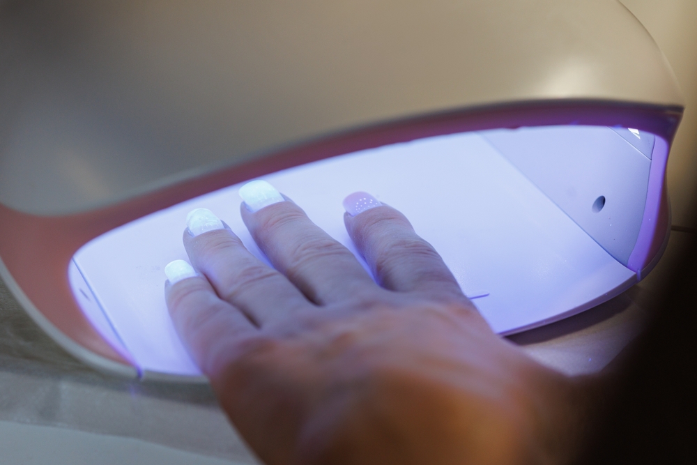 Curing Gel Nails Under UV Lamp in Nail Salon, Curing Gel Nails Under UV Lamp in Nail Salon.