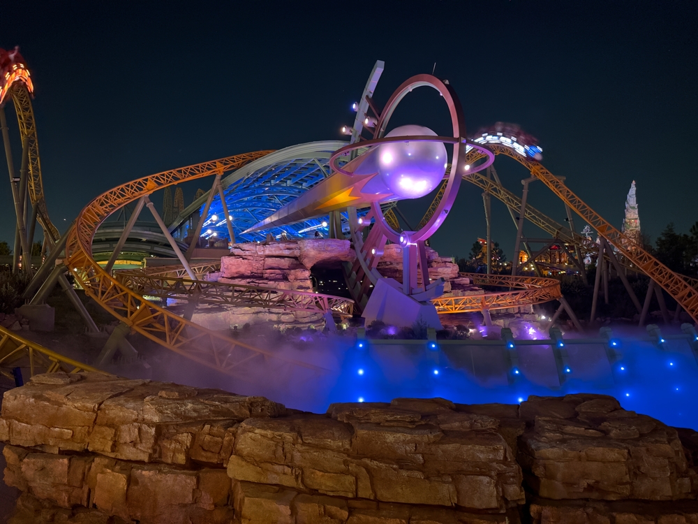 Orlando, Florida, USA - August 20, 2025: The Stardust Racers roller coaster at Universal’s Epic Universe lights up the night with high-speed thrills, neon tracks, and futuristic design.