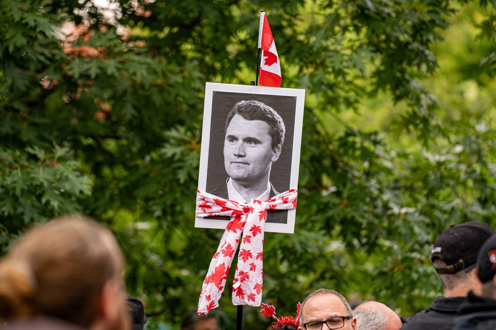 View of Charlie Kirk posters at anti-immigrant rally. Toronto, Canada - September 13, 2025.