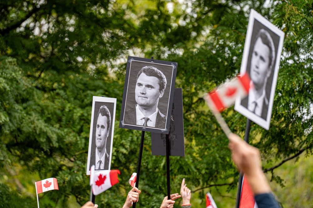 View of Charlie Kirk posters at anti-immigrant rally. Toronto, Canada - September 13, 2025.
