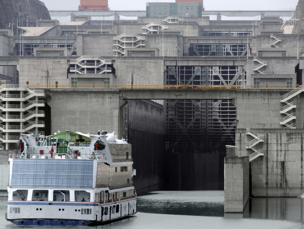 foggy scenery with ferry in front of the Three Gorges Dam at Yangtze River in China