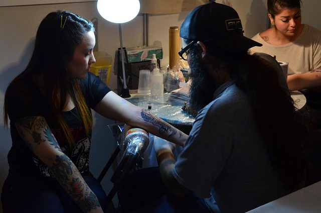woman getting tattoo 