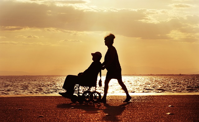person in wheelchair on the beach