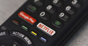 TV remote with streaming service shortcut buttons Netflix and Google Play
