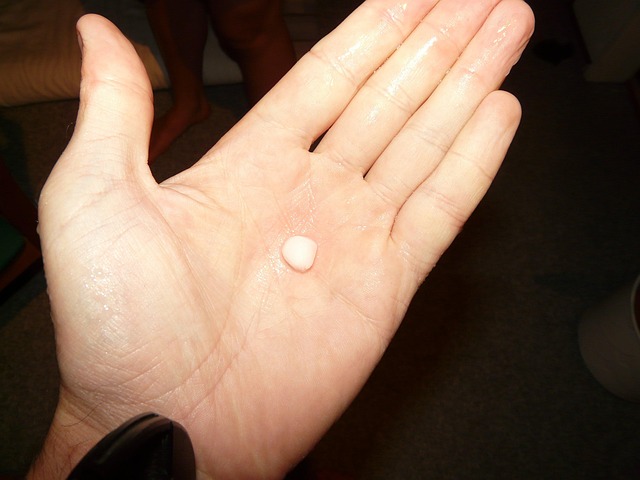 a hand holding a hailstone