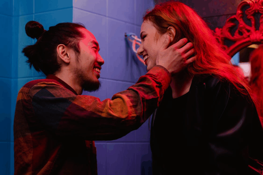 Photo of a Man Touching a Woman's Neck