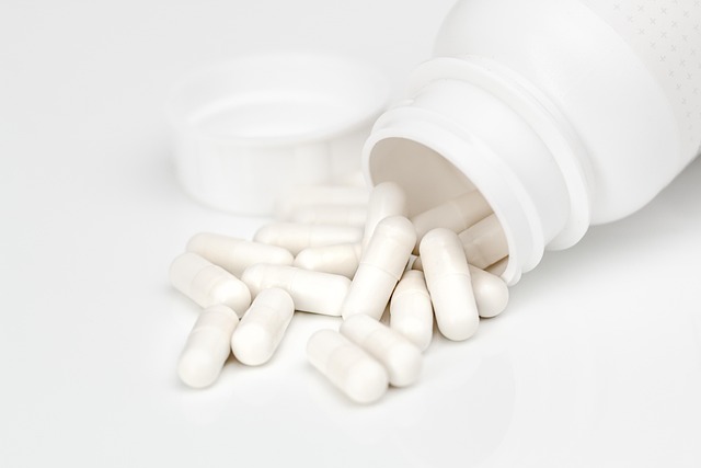 an open bottle of white pills